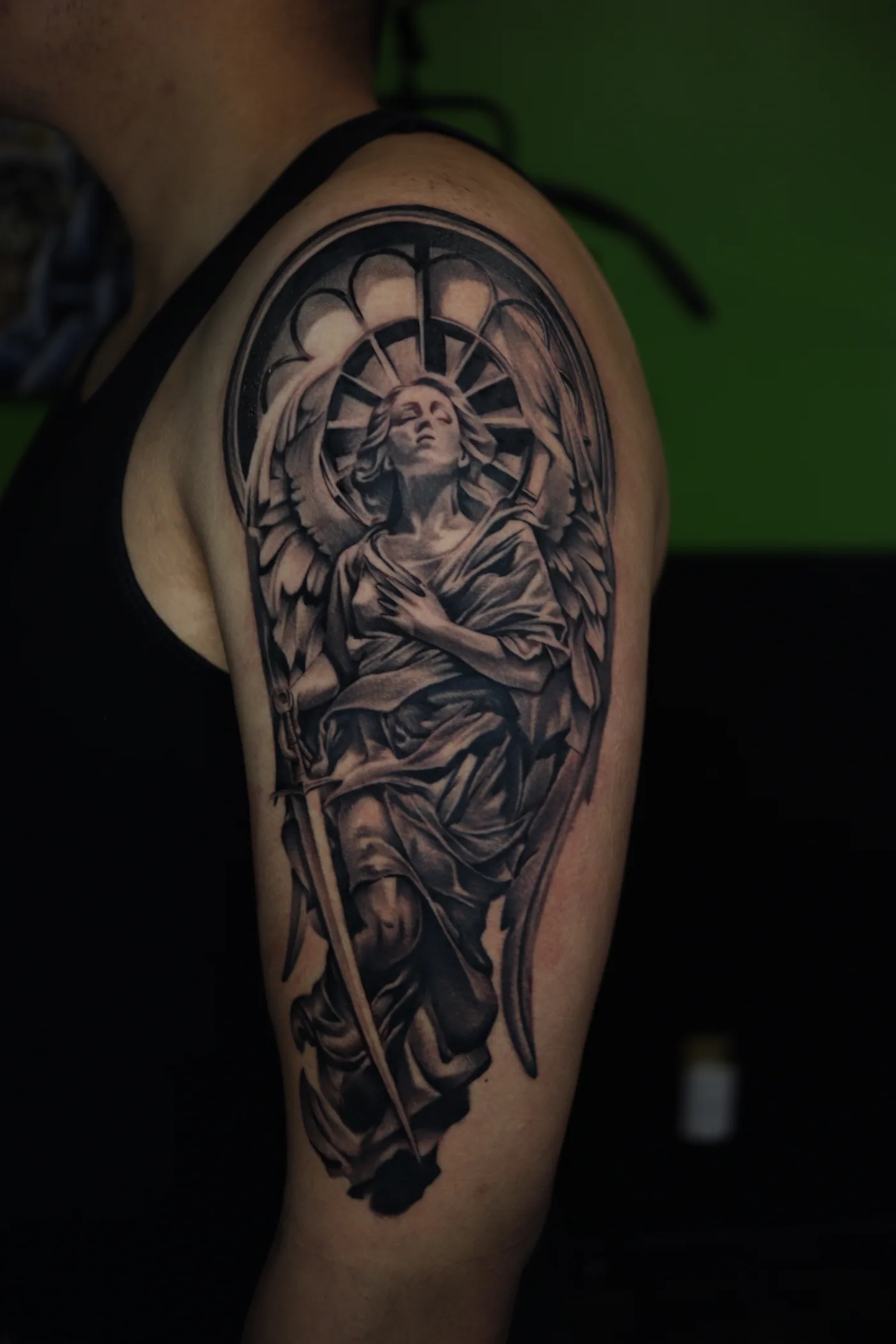 Detailed black and grey forearm tattoo by Eddie Gonzalez