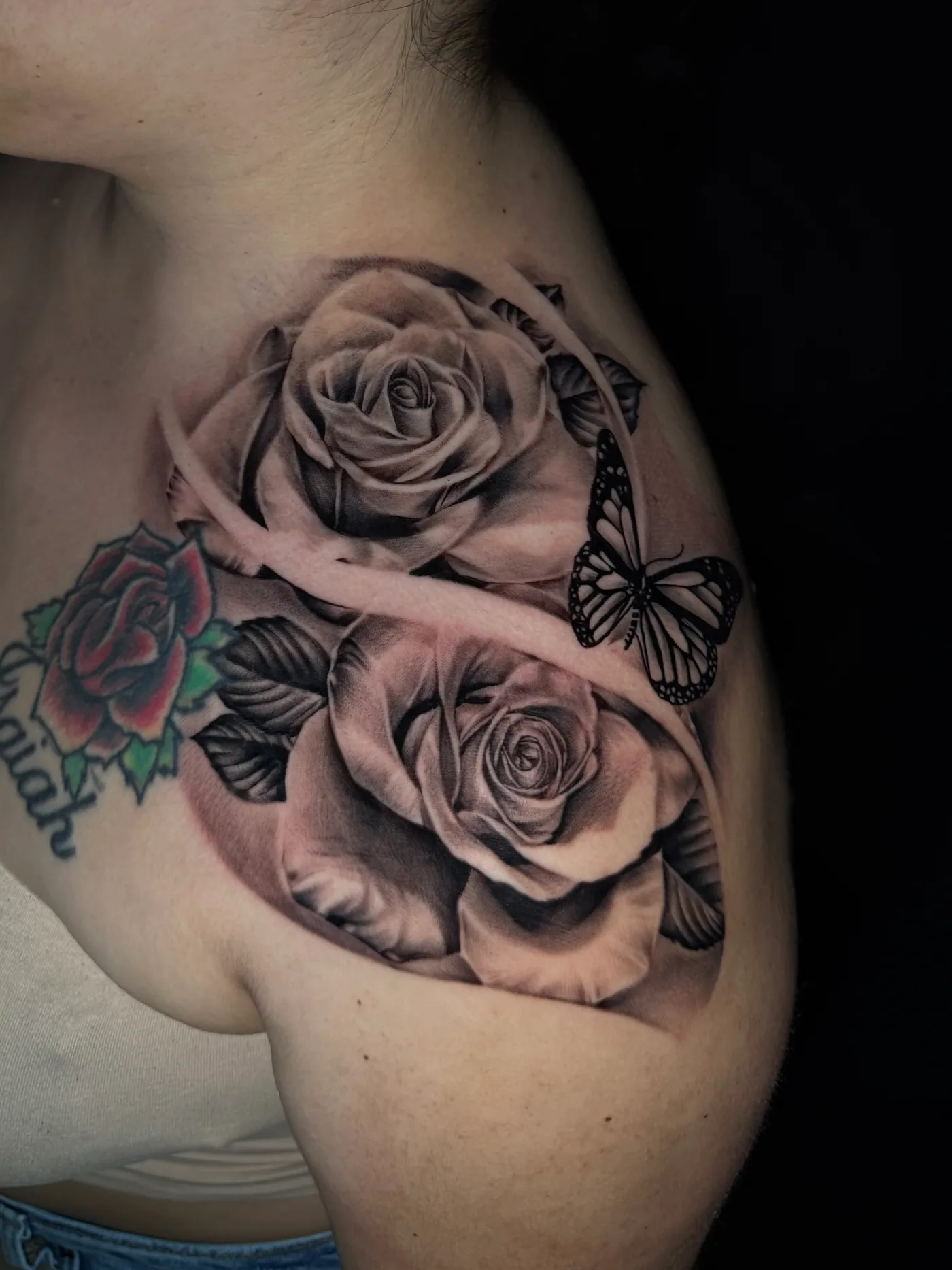 Roses and butterfly tattoo by Eddie Gonzalez