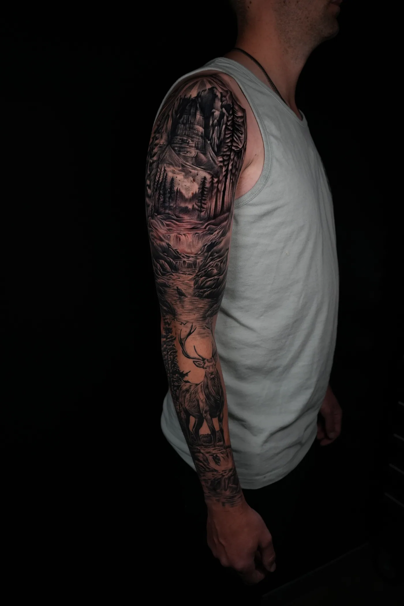 Full-arm composition tattoo by Eddie Gonzalez